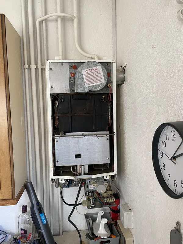Stripped old combi boiler at end of life